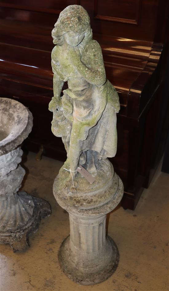 A reconstituted stone statue of a water carrier, on plinth, width approx. 26cm, height approx. 114cm